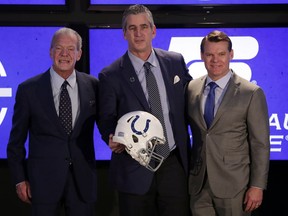 Indianapolis Colts head coach Frank Reich, center, poses with owner Jim Irsay, left, and general manager Chris Ballard after he was introduced at the team's new had football coach during a press conference in Indianapolis, Tuesday, Feb. 13, 2018.