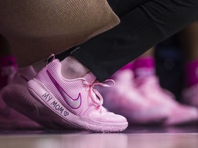 Georgia Tech head coach MaChelle Joseph wears pink shoes with handwriting that read's "My Mom" along the sole as teams wear pink for breast cancer awareness during an NCAA college basketball game against Notre Dame, Sunday, Feb. 11, 2018, in South Bend, Ind.