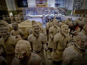 The Terracotta Army, the famous statuary group who symbolically guarded the mausoleum of the first Chinese Emperor Qin Shi Huang, is seen here on display inside the sixteenth-century Basilica dello Spirito Santo (Basilica of the Holy Spirit) in Naples, southern Italy, Tuesday, Oct. 24, 2017.