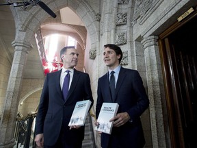 Minister of Finance Bill Morneau walks with Prime Minister Justin Trudeau before tabling the budget in the House of Commons on Parliament Hill in Ottawa on Tuesday, Feb. 27, 2018.