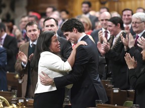 Prime Minister Justin Trudeau is embraced by Minister of Justice and Attorney General of Canada Jody Wilson-Raybould after delivering a speech on the recognition and implementation of Indigenous rights in the House of Commons on Wednesday, Feb. 14, 2018.