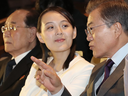 South Koran President Moon Jae-in talks with Kim Yo Jong, North Korean leader Kim Jong Un's sister, during a performance of North Korea's Samjiyon Orchestra.