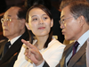 South Koran President Moon Jae-in talks with Kim Yo Jong, North Korean leader Kim Jong Un’s sister, during a performance of North Korea’s Samjiyon Orchestra.