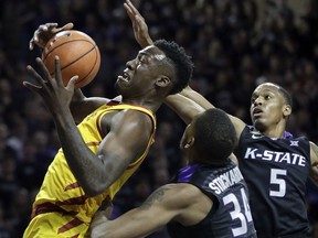 Iowa State forward Cameron Lard (2) rebounds against Kansas State forward Levi Stockard III (34) and guard Barry Brown (5) during the first half of an NCAA college basketball game in Manhattan, Kan., Saturday, Feb. 17, 2018.