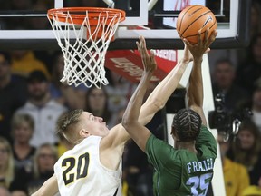 Wichita State center Rauno Nurger blocks the shot of Tulane guard Melvin Frazier during the first half of an NCAA college basketball game Wednesday, Feb. 21, 2018, in Wichita, Kan.