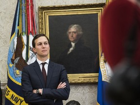 White House adviser Jared Kushner watches as President Trump signs an executive order in the Oval Office at the White House on Jan. 9. MUST