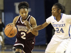 Mississippi State's Morgan William (2) drives on Kentucky's Taylor Murray (24) during the first quarter of an NCAA college basketball game, Sunday, Feb. 25, 2018, in Lexington, Ky.