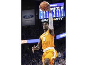 Tennessee's Jordan Bone (0) shots a layup during the second half of an NCAA college basketball game against Kentucky, Tuesday, Feb. 6, 2018, in Lexington, Ky. Tennessee won 61-59.