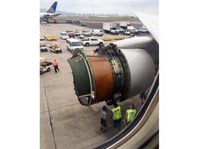 This photo provided by passenger Haley Ebert shows damage to an engine on what the FAA says is a Boeing 777 after parts came off the jetliner during its flight from San Francisco to Honolulu Tuesday, Feb. 13, 2018. The plane landed safely as emergency responders waited nearby. United Airlines spokeswoman Natalie Noonan says Flight 1175 made an emergency landing due to a mechanical issue. (Haley Ebert via AP)