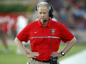 FILE - In this Sept. 10, 2016, file photo New Mexico coach Bob Davie walks in the sideline during the first half of an NCAA college football game against New Mexico State in Las Cruces, N.M. The University of New Mexico suspended Davie on Thursday, Feb. 8, 2018, for 30 days without pay, following multiple investigations that examined whether he and coaching staff interfered with criminal investigations or misconduct cases involving players.