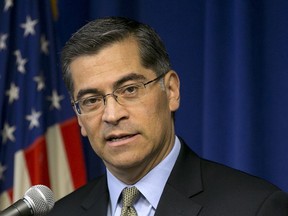 FILE - In this Jan. 24, 2018, file photo California Attorney General Xavier Becerra talks during a news conference in Sacramento, Calif. The U.S. Department of Justice is appealing a California judge's decision to temporarily block new Trump administration rules allowing more employers to opt out of providing women with no-cost birth control. Becerra sued the Trump administration in October challenging the new rules and on Friday, Feb. 16, 2018, he said that the changes unjustly target women.