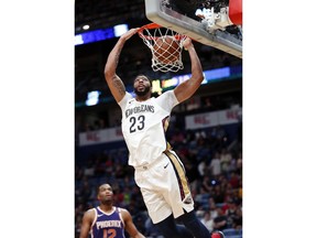New Orleans Pelicans guard Ian Clark (2)3 slam dunks in the first half of an NBA basketball game against the Phoenix Suns in New Orleans, Monday, Feb. 26, 2018.
