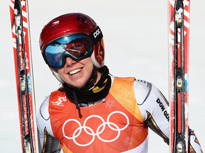 Ester Ledecka of the Czech Republic made a stunning run from back in the pack to take the Olympic super-G title on Saturday, with a mistake costing Lindsey Vonn a spot on the podium.
