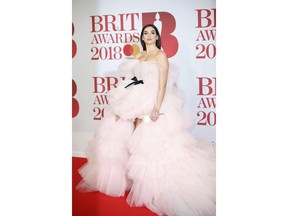 Singer Dua Lipa poses for photographers upon arrival at the Brit Awards 2018 in London, Wednesday, Feb. 21, 2018.