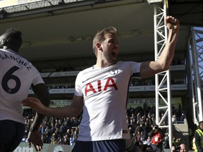 Tottenham Hotspur's Harry Kane celebrates after scoring his side's first goal during the English Premier League soccer match between Crystal Palace and Tottenham Hotspur at Selhurst Park, London, Sunday, Feb. 25, 2018.