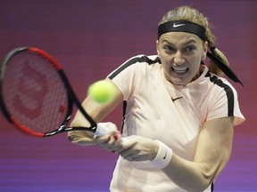FILE - In this file photo dated Sunday, Feb. 4, 2018, Petra Kvitova of Czech Republic in action during the St. Petersburg Ladies Trophy-2018 tennis tournament final match in St.Petersburg, Russia. Two-time Wimbledon champion Petra Kvitova will face Viktorija Golubic in the opening match as the Czech Republic plays Switzerland in the first round of the upcoming Fed Cup.