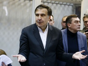 This Monday, Dec. 11, 2017  file photo shows former Georgian President Mikheil Saakashvili as he gestures during a hearing in a court room in Kiev, Ukraine.