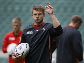 FILE - In this Friday, Oct. 16, 2015 file photo Wales' player Dan Biggar attends a training session at Twickenham stadium in London. Fit-again backs Dan Biggar, Liam Williams and Leigh Halfpenny were recalled by Wales on Tuesday Feb. 20, 2018 to play Ireland in Six Nations rugby this weekend.