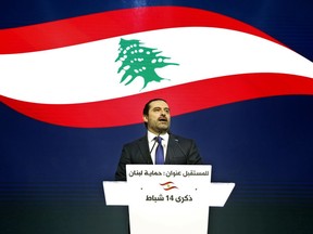 FILE - In this Wednesday, Feb. 14, 2018 file photo, Lebanese Prime Minister Saad Hariri, speaks during a ceremony to mark the 13th anniversary of the assassination of his father, former Prime Minister Rafik Hariri, in Beirut, Lebanon. The office of Lebanon's Prime Minister says he has received an invitation to visit Saudi Arabia from an envoy of the Gulf monarch. It's the first such gesture following tension between the two countries in the wake of the now-reversed resignation of Saad Hariri.
