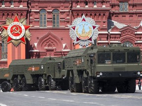 FILE - In this Saturday, May 9, 2015 file photo, Iskander missile launchers are driven during the Victory Parade marking the 70th anniversary of the defeat of the Nazis in World War II, in Red Square in Moscow. Lithuania's president says Russia has deployed additional nuclear-capable missiles in its Baltic Sea exclave of Kaliningrad on a permanent basis, calling it a threat to Europe. Dalia Grybauskaite told reporters Monday, Feb. 5, 2018 after visiting NATO troops in the town of Rukla that "Iskander missiles are being stationed in Kaliningrad for permanent presence as we speak."