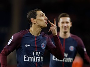 FILE - In this Wednesday, Jan.17, 2018 file photo, PSG's Angel Di Maria celebrates after scoring during his French League One soccer match between Paris-Saint-Germain and Dijon, at the Parc des Princes stadium in Paris, France. Angel Di Maria has arguably been PSG's best player in recent weeks, scoring six goals in his past seven games and playing with the flair that once made him one of soccer's most sought-after wingers. As the transfer window shut at midnight on Wednesday, Jan. 31, Di Maria was preparing for Saturday's French league game away to Lille. Some contrast from the final days of the summer transfer window, when it seemed PSG's major priority was to sell him.