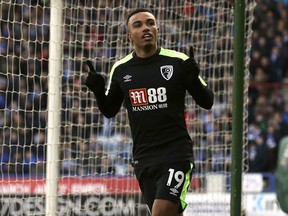 AFC Bournemouth's Junior Stanislas celebrates scoring his team's equalising goal during their English Premier League soccer match against Huddersfield at the John Smith's Stadium, Huddersfield, England, Sunday, Feb. 11, 2018.