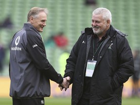 Ireland head rugby coach Joe Schmidt, left, and Wales head coach Warren Gatland shake hands before their Six Nations rugby match at the Aviva Stadium in Dublin, Saturday Feb. 24, 2018.