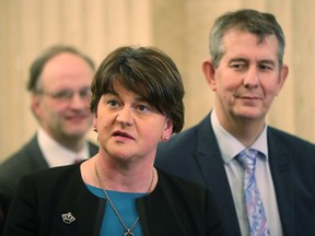 DUP's Arlene Foster speaks to the media at Stormont Parliament buildings in Belfast, Northern Ireland, Monday Feb. 12, 2018,  as Prime Minister Theresa May and her Irish counterpart Leo Varadkar are holding crunch talks at Stormont House. Northern Ireland's Catholic-Protestant power-sharing government has been suspended since January 2017, but with renewed high lefel talks both sides said Monday that progress has been made.