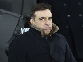 Swansea City manager Carlos Carvalhal reacts before the game against Notts County, during the Emirates FA Cup, fourth round replay match at the Liberty Stadium in Swansea, England, Tuesday Feb. 6, 2018.