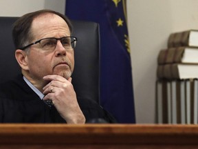 Judge Charles Temple listens to attorney Steven M. Gordon, who represents lottery winner "Jane Doe," during a hearing in the Jane Doe v. NH Lottery Commission case at Hillsborough Superior Court in Nashua, N.H., Tuesday, Feb. 13, 2018.