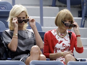 FILE - This is a Sunday, Sept. 13, 2009  file photo of actress Charlize Theron, left, and American Vogue editor Anna Wintour attend the men's semifinals match between Rafael Nadal, of Spain, and Juan Martin del Potro, of Argentina, at the U.S. Open tennis tournament in New York,