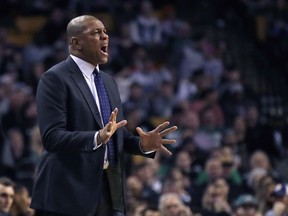 Los Angeles Clippers head coach Doc River calls to his players during the first quarter of an NBA basketball game against the Boston Celtics in Boston, Wednesday, Feb. 14, 2018.
