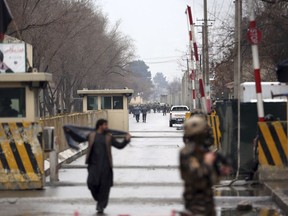 Security forces inspect the site of a suicide bombing in the diplomatic area of capital Kabul, Afghanistan, Saturday, Feb. 24, 2018.  Interior ministry spokesman Najib Danish said several people were wounded in Saturday's attack in the Shash Darak area of Kabul, near NATO headquarters and not far from the U.S. Embassy.