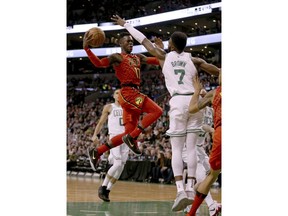 Atlanta Hawks guard Dennis Schroeder (17) drives to the basket against Boston Celtics guard Jaylen Brown (7) during the first half of an NBA basketball game Friday, Feb. 2, 2018, in Boston.