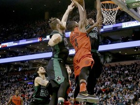 Portland Trail Blazers forward Maurice Harkless (4) drives to the basket against Boston Celtics defenders Aron Baynes and Al Horford (42) during the first half of an NBA basketball game, Sunday, Feb. 4, 2018, in Boston.