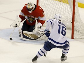 Florida Panthers goaltender Roberto Luongo makes a third period save in front of the Toronto Maple Leafs' Mitchell Marner  during their game Tuesday night  in Sunrise, Fla. The Panthers won 3-2 in overtime.