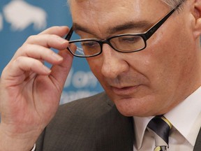 Manitoba Finance Minister Stan Struthers pauses during a press conference at the provincial legislature in Winnipeg, Tuesday, April 16, 2013.