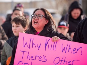 Colten Boushie's mother Debbie Baptiste addresses demonstrators gathered outside of the courthouse in North Battleford, Sask., on Saturday, February 10, 2018.