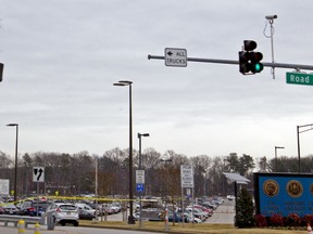 The National Security Agency gate with yellow tape in Fort Meade, Md., Wednesday, Feb. 14, 2018. One person was wounded in a shooting Wednesday morning outside the National Security Agency campus at Fort Meade.