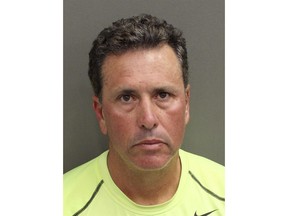FILE - This undated file photo provided by Orange County Corrections shows Gustavo Falcon. Court records show a change-of-plea hearing is scheduled on Thursday, Feb. 1, 2018, in Miami federal court for Falcon. He is expected to plead guilty to a 1991 indictment charging him in a major cocaine smuggling operation during the 1980s.