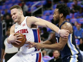 Detroit Pistons forward Blake Griffin (23) is defended by Memphis Grizzlies guard Wayne Selden while going to the basket during the first half of an NBA basketball game Thursday, Feb. 1, 2018, in Detroit.