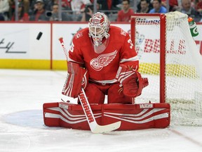 Detroit Red Wings goaltender Jimmy Howard (35) blocks a shot against the Nashville Predators in the first period of an NHL hockey game, Tuesday, Feb. 20, 2018, in Detroit.