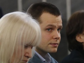 In this photo taken on Monday, Feb. 19, 2018, Lukasz Herba, right, sits by his lawyer Katia Kolakowska at a Milan court, Italy. A Polish man charged with kidnapping a British model for ransom has claimed she agreed to the ploy in a bid to boost her career. Lukasz Herba, testifying in his own defense at an Italian trial Wednesday, said 20-year-old Chloe Ayling didn't know that the kidnapping plot was afoot when she arrived in Milan for a modeling job in July. Herba said that he revealed it to her soon after, and that she agreed to it.