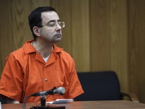Larry Nassar listens as lead prosecutor Angela Povilaitis makes her closing statements Monday, Feb. 5, 2018, the third and final day of sentencing in Eaton County Court in Charlotte, Mich., where Nassar will be sentenced on three counts of sexual assault. Nassar already has been sentenced to 40 to 175 years in prison in another county and is starting his time behind bars with a 60-year federal term for child pornography crimes.