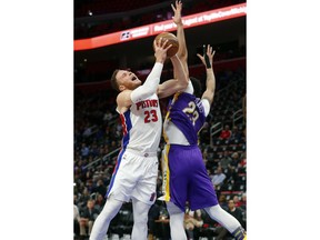 Detroit Pistons forward Blake Griffin, left, drives on New Orleans Pelicans forward Anthony Davis (23) in the first half of an NBA basketball game in Detroit, Monday, Feb. 12, 2018.