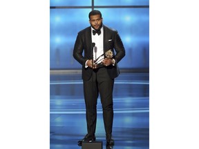 In this photo provided by the NFL, Aaron Donald of the Los Angeles Rams accepts the award for The Associated Press NFL Defensive Player of the Year presented by Old Spice at the 7th Annual NFL Honors at the Cyrus Northrop Memorial Auditorium on Saturday, Feb. 3, 2018, in Minneapolis.