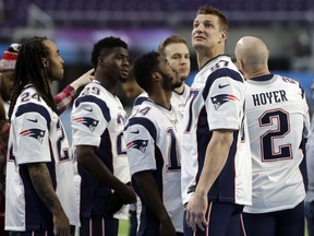 New England Patriots tight end Rob Gronkowski (87) looks around U.S. Bank Stadium before the team photo is made Saturday, Feb. 3, 2018, in Minneapolis. The Patriots are scheduled to face the Philadelphia Eagles in the NFL Super Bowl 52 football game Sunday, Feb. 4.