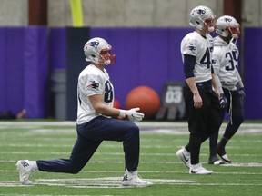 New England Patriots tight end Rob Gronkowski, left, stretches during a practice Thursday, Feb. 1, 2018, in Minneapolis. The Patriots are scheduled to face the Philadelphia Eagles in the NFL Super Bowl 52 football game Sunday, Feb. 4.