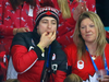 Scott Moir whistles from the stands at the Olympic women’s hockey gold-medal game.