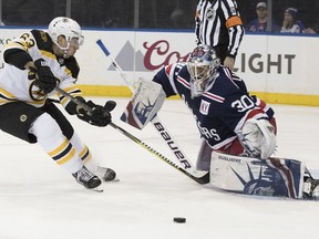 New York Rangers goaltender Henrik Lundqvist (30) blocks a shot by Boston Bruins left wing Brad Marchand (63) during the first period of an NHL hockey game Wednesday, Feb. 7, 2018, at Madison Square Garden in New York.